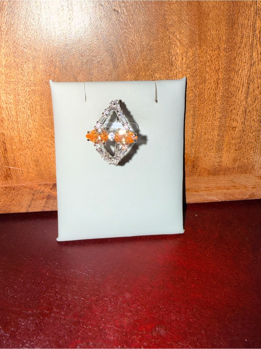 Silver Tone Ring with Orange Accent Stones